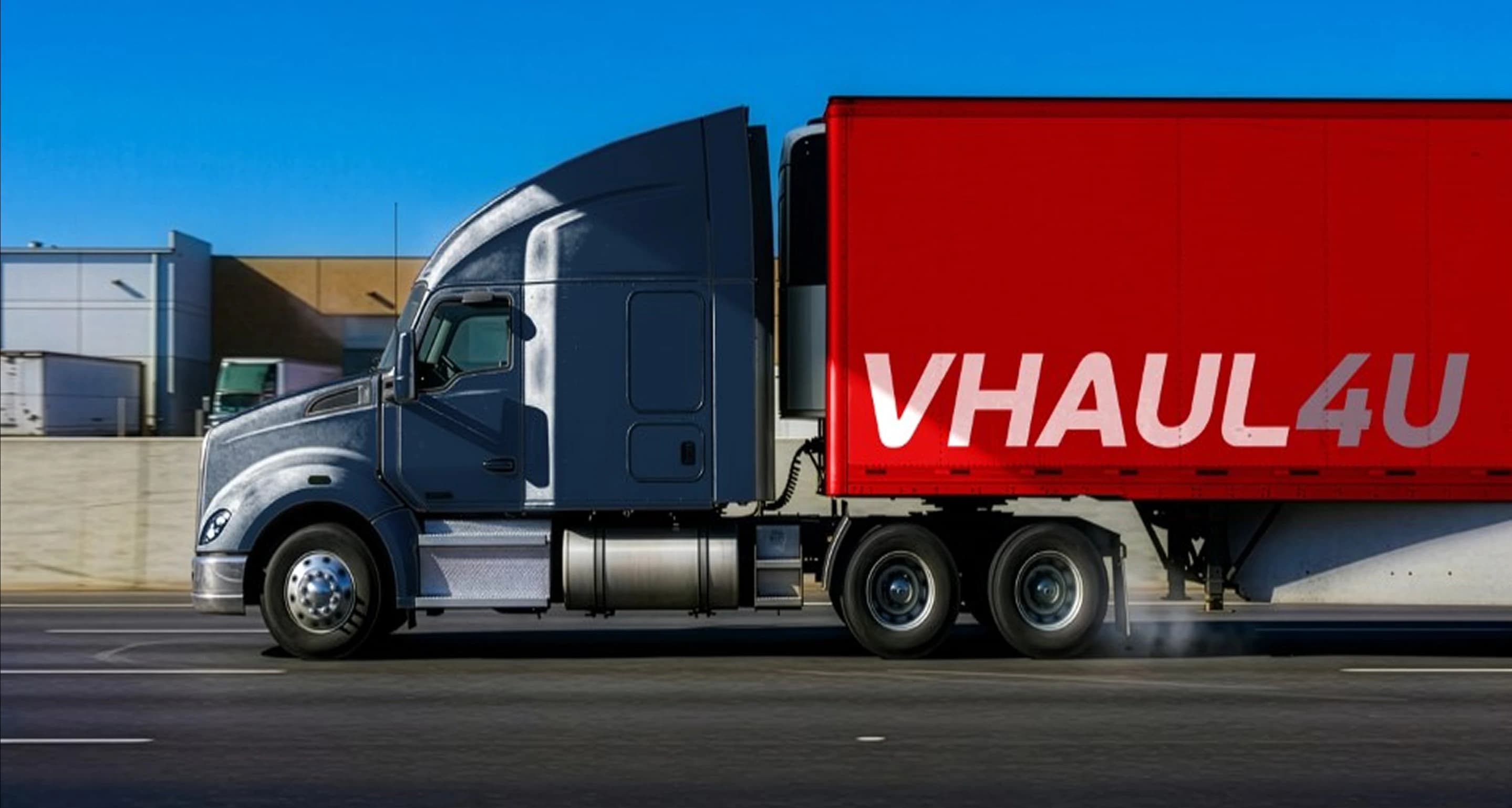 A red and white semi-truck on the road representing VHaul4U's nationwide trucking solutions